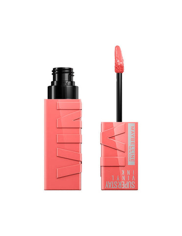 Maybelline Superstay Vinyl Ink liquid lipstick in shade 100-Charmed, featuring a sleek applicator and vibrant color.