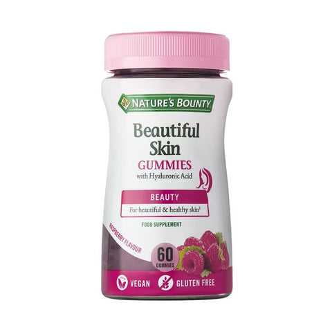 Nature's Bounty Beautiful Skin gummies by Jag Couture London - New York, showing a close-up of the orange flavored skincare supplement.