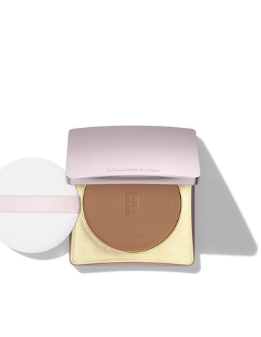 Close-up of Elizabeth Arden Arden Maq Powder Flawless Finish Skin Care compact with a mirror and applicator brush.