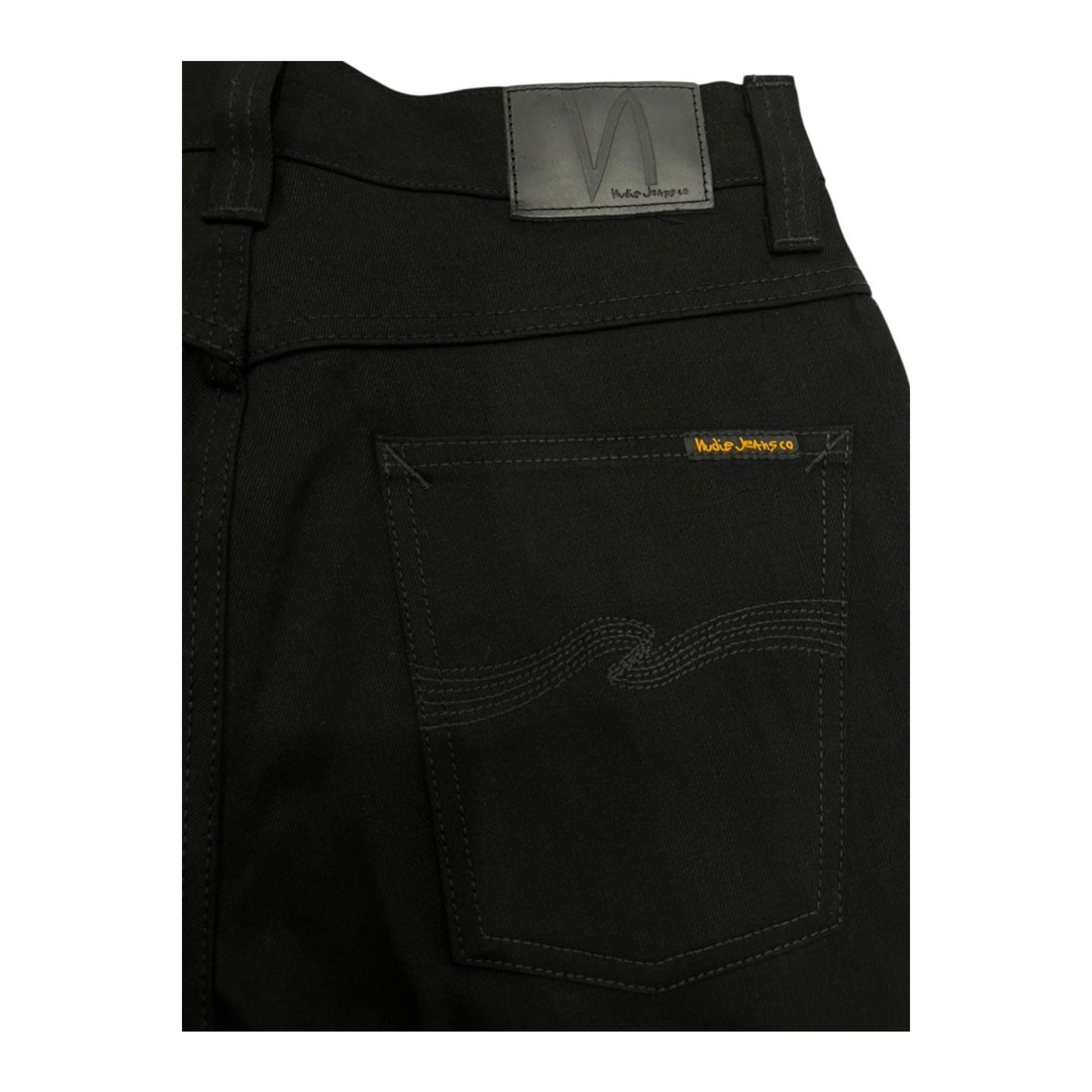 Jag Couture London-New York Nudie Jeans NJ3088 SlimJim NeroBlack denim jeans displayed flat with visible stitching and pockets.