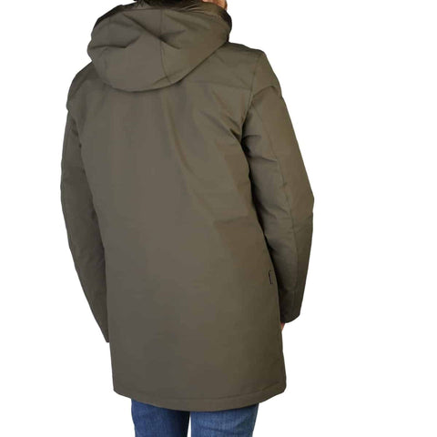 Green Woolrich Stretch Mountain jacket displayed on a hanger, showcasing its fabric and design details.