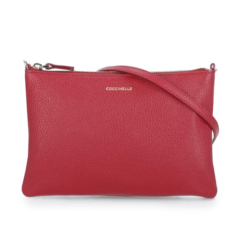 Jag Couture London New York Coccinelle handbag with sleek leather design and silver hardware, close-up view.