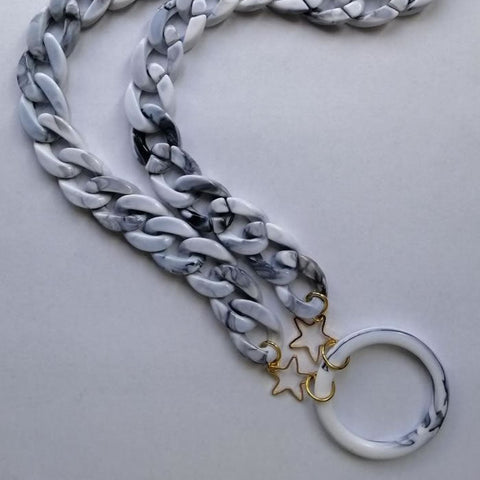 Gray marble sunglasses necklace by Jag Couture London - New York, featuring a stylish accessory with marble and metal details.