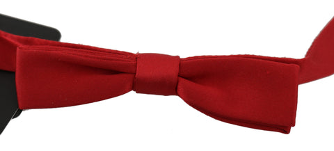 Red 100% silk slim adjustable neck bow tie by Dolce & Gabbana, featuring a classic papillon style with a sleek, elegant design.