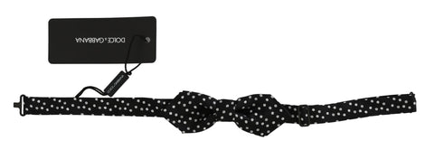 Black silk bow tie with polka dots, adjustable neck strap, by Dolce & Gabbana, designed for men's formal wear.