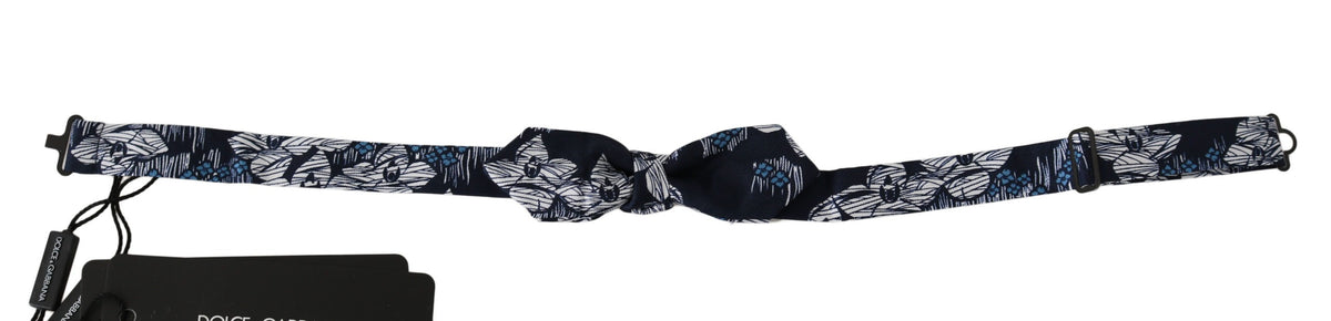 Navy blue floral slim adjustable men's bow tie by Dolce & Gabbana, featuring a stylish floral pattern and classic bow shape.