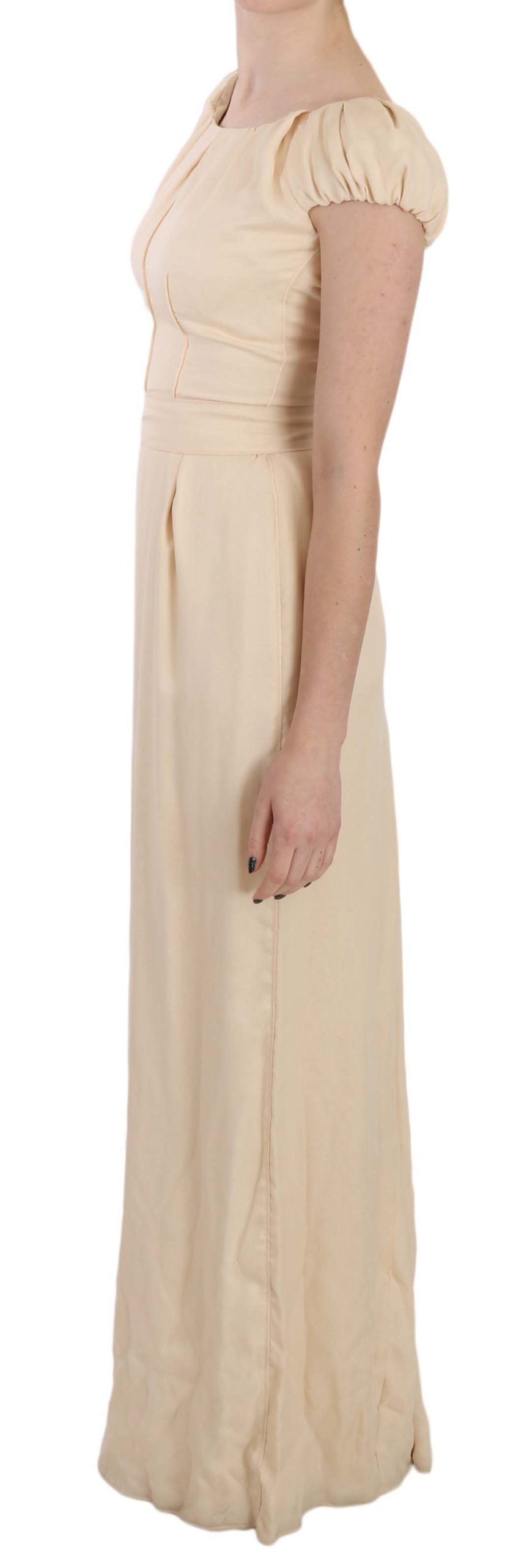 Beige silk column gown with cap sleeves by Dolce & Gabbana, floor-length dress with elegant, smooth fabric and a sleek silhouette.
