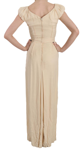 Beige silk column gown with cap sleeves by Dolce & Gabbana, featuring a sleek, elegant silhouette and smooth fabric.