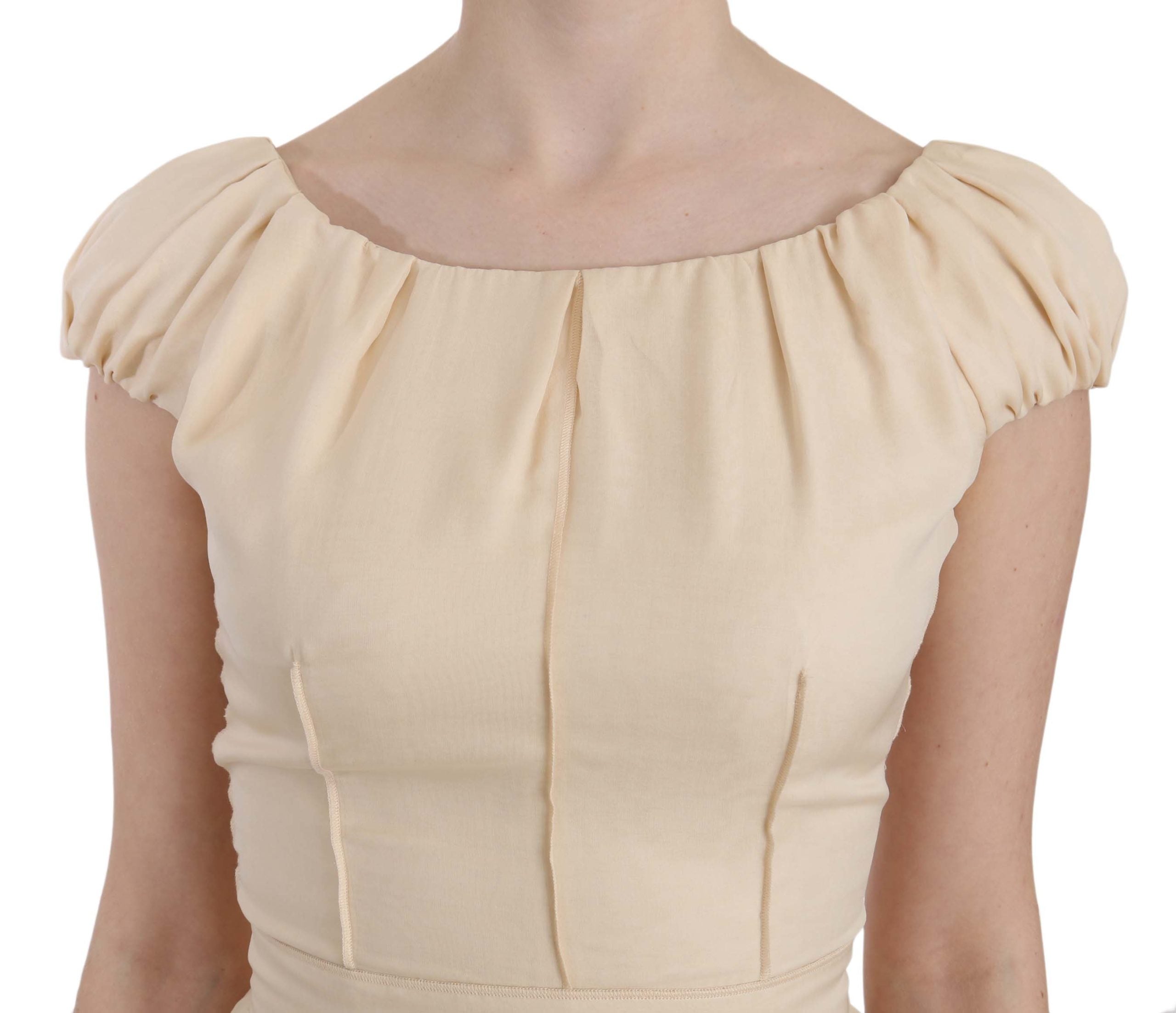 Beige silk column gown with cap sleeves from Dolce & Gabbana, elegant and flowing floor-length dress for formal occasions.