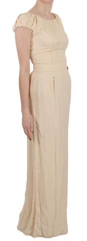 Beige silk column gown with cap sleeves by Dolce & Gabbana, elegant floor-length dress with a smooth, flowing silhouette.