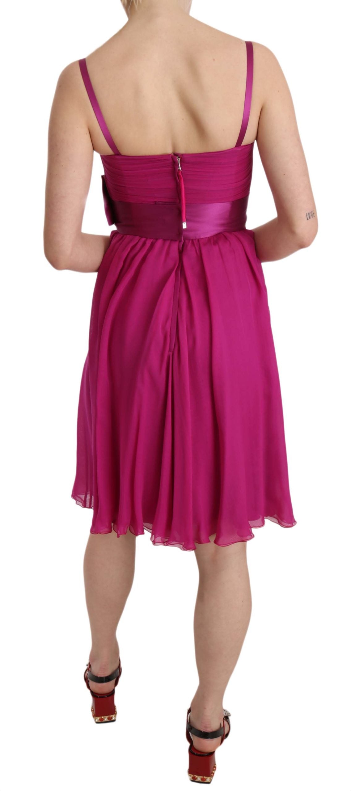 Fuchsia pink bow silk sleeveless dress by Dolce & Gabbana, featuring a fitted bodice and elegant bow detail at the waist.