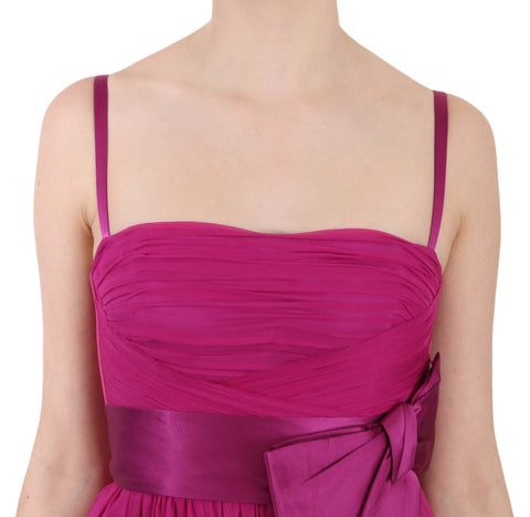 Fuchsia pink silk sleeveless dress with bow detail by Dolce & Gabbana, elegant and stylish for special occasions.