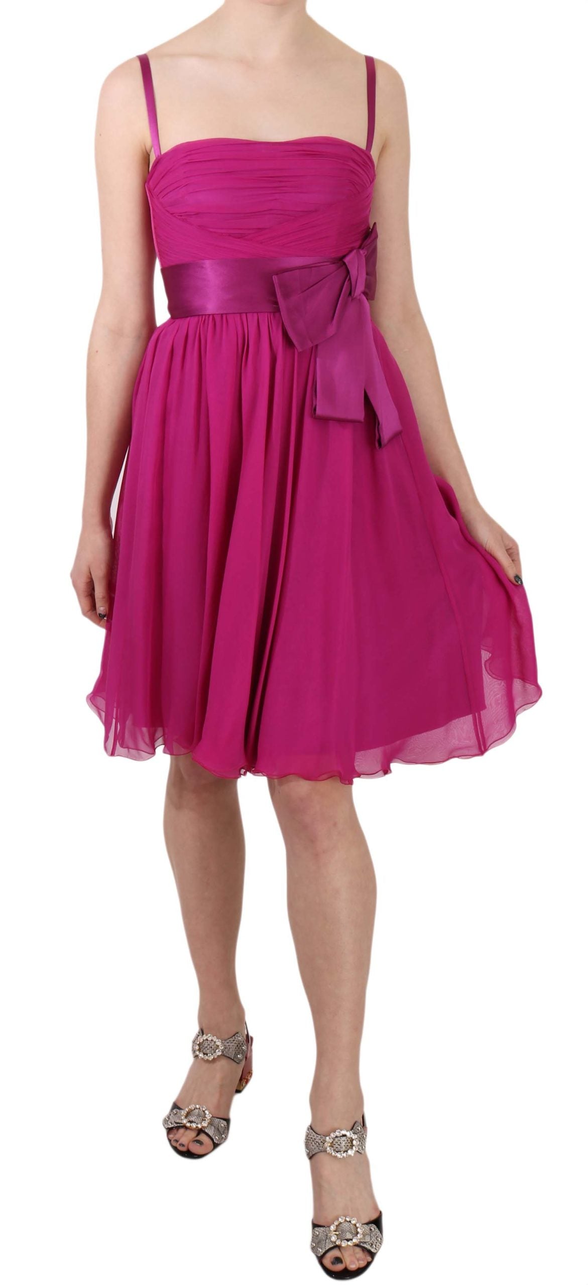 Fuchsia pink silk sleeveless dress with bow detail by Dolce & Gabbana, elegant and stylish for special occasions.