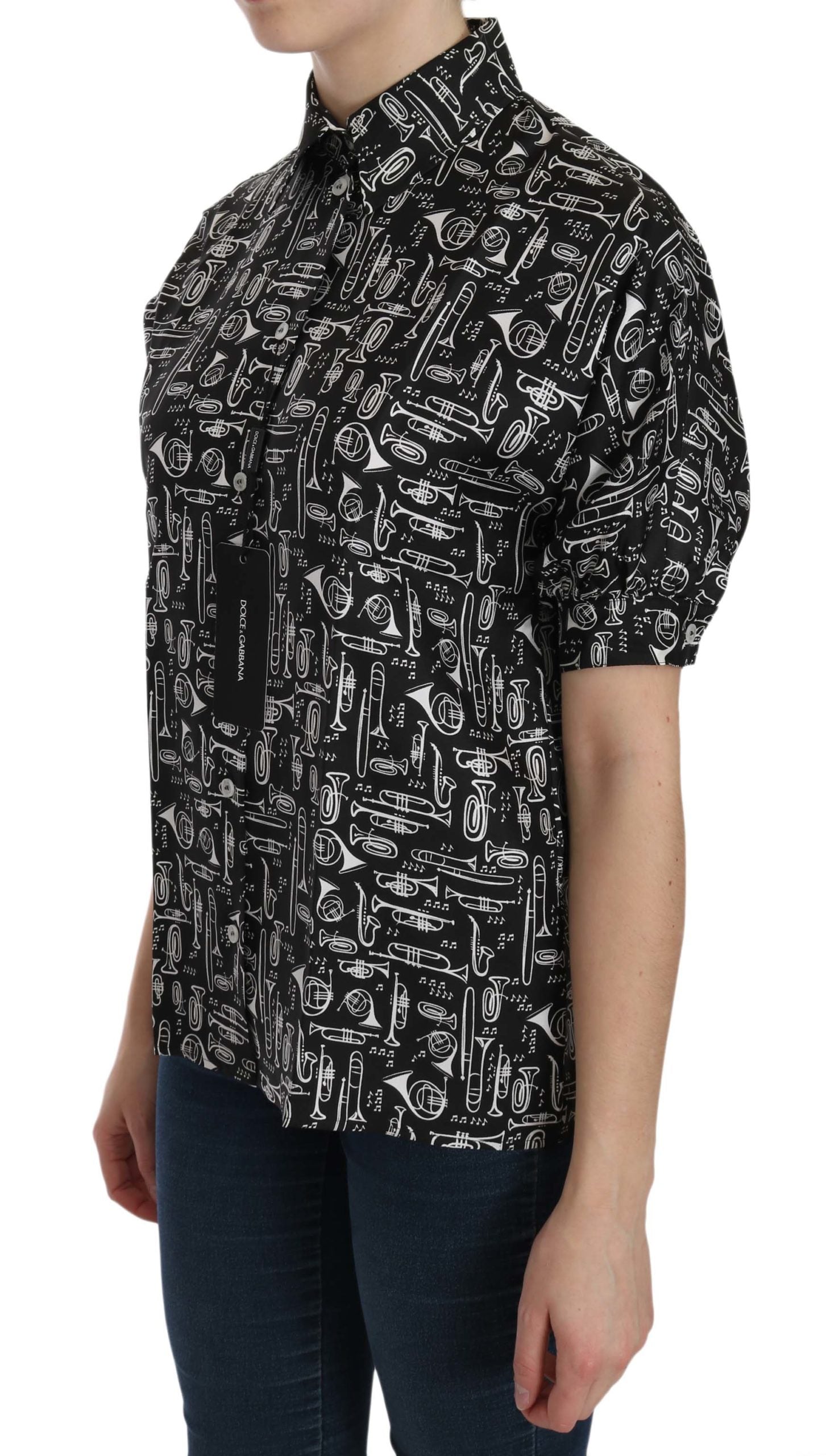 Black Dolce & Gabbana collared blouse shirt with musical instrument print, long sleeves, and tailored fit.
