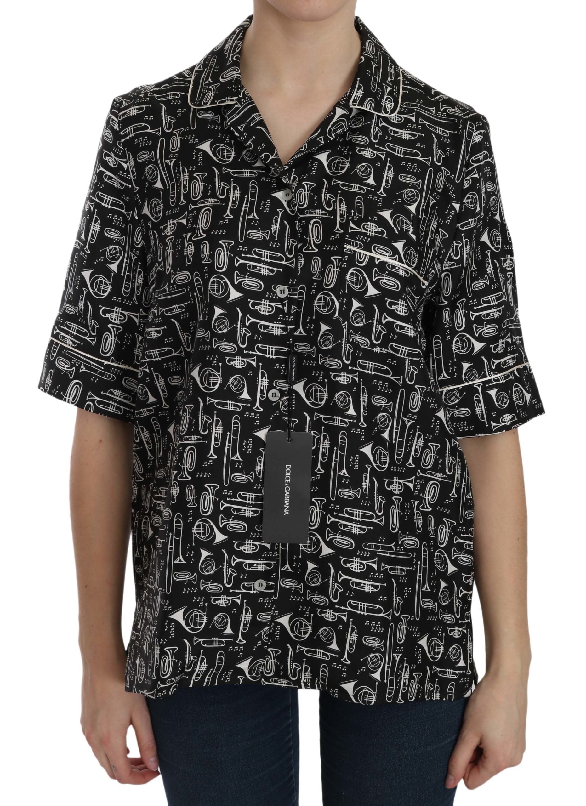 Black silk top with musical instrument print by Dolce & Gabbana, featuring a stylish and elegant design.