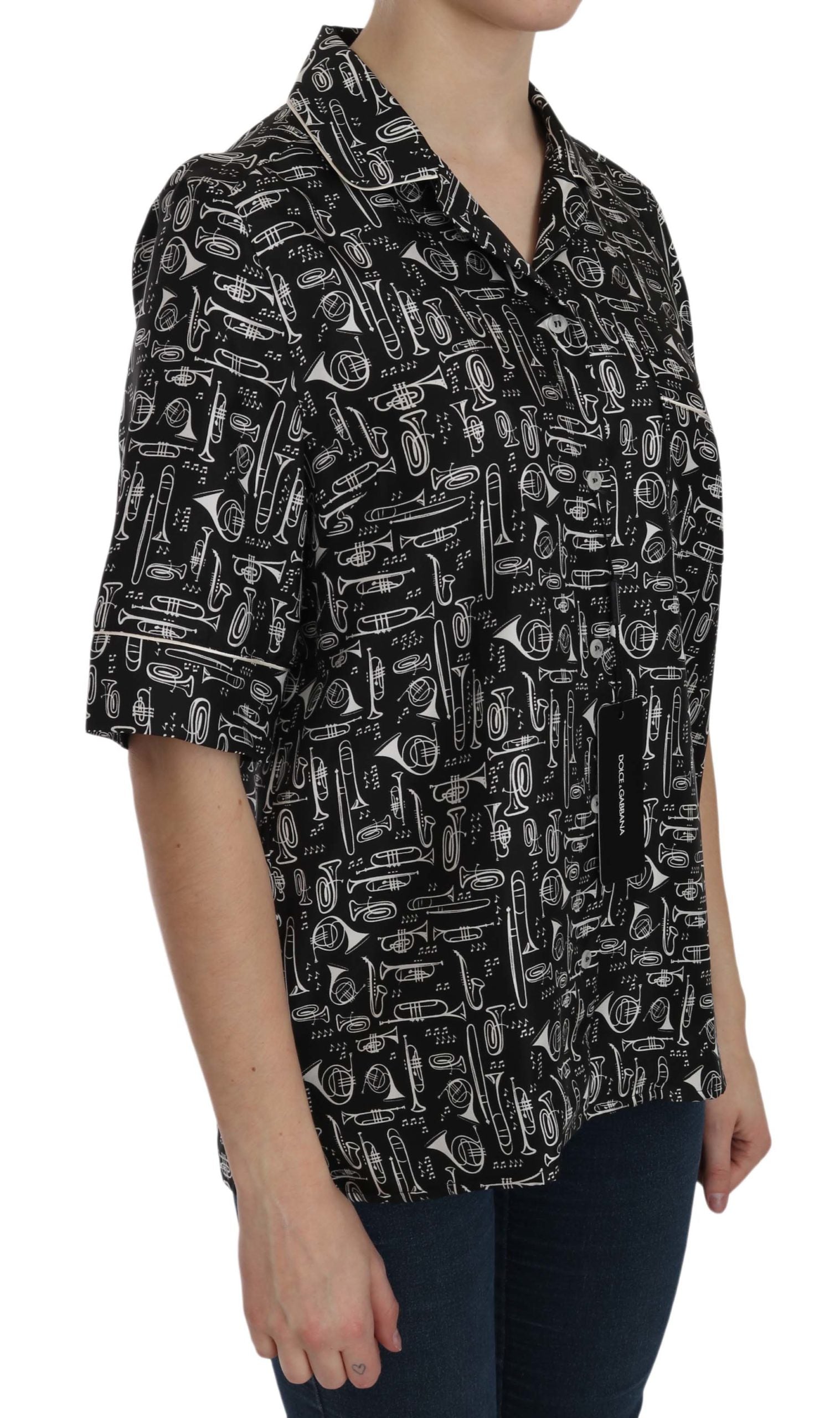 Black musical instrument print silk top by Dolce & Gabbana, featuring a sleek design and vibrant instrument graphics.