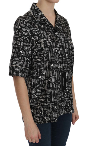 Black musical instrument print silk top by Dolce & Gabbana, featuring a sleek design and vibrant instrument graphics.