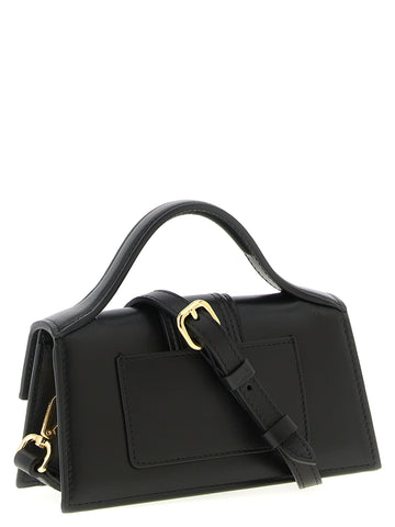 Jacquemus black cowhide handbag with sleek design, top handle, and minimalist style displayed in the image.