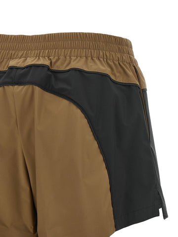 Balenciaga brown polyester Bermuda shorts laid flat, showing the classic knee-length design and clean stitching.