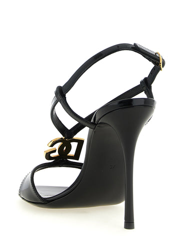 Black calfskin stiletto heel sandals by Dolce & Gabbana with ankle straps and open toe design.