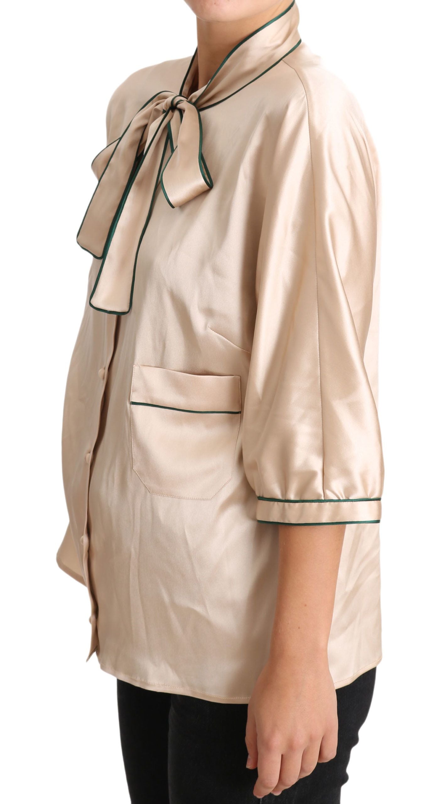 Beige silk stretch top blouse with ribbon detail by Dolce & Gabbana, featuring a fitted style and elegant neckline.