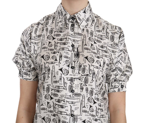Dolce & Gabbana silk blouse with trumpet print and button front, stylish button-up top for elegant casual wear.