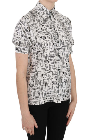 Dolce & Gabbana silk blouse featuring a trumpet print, button front, and elegant button-up style, displayed in a close-up view.