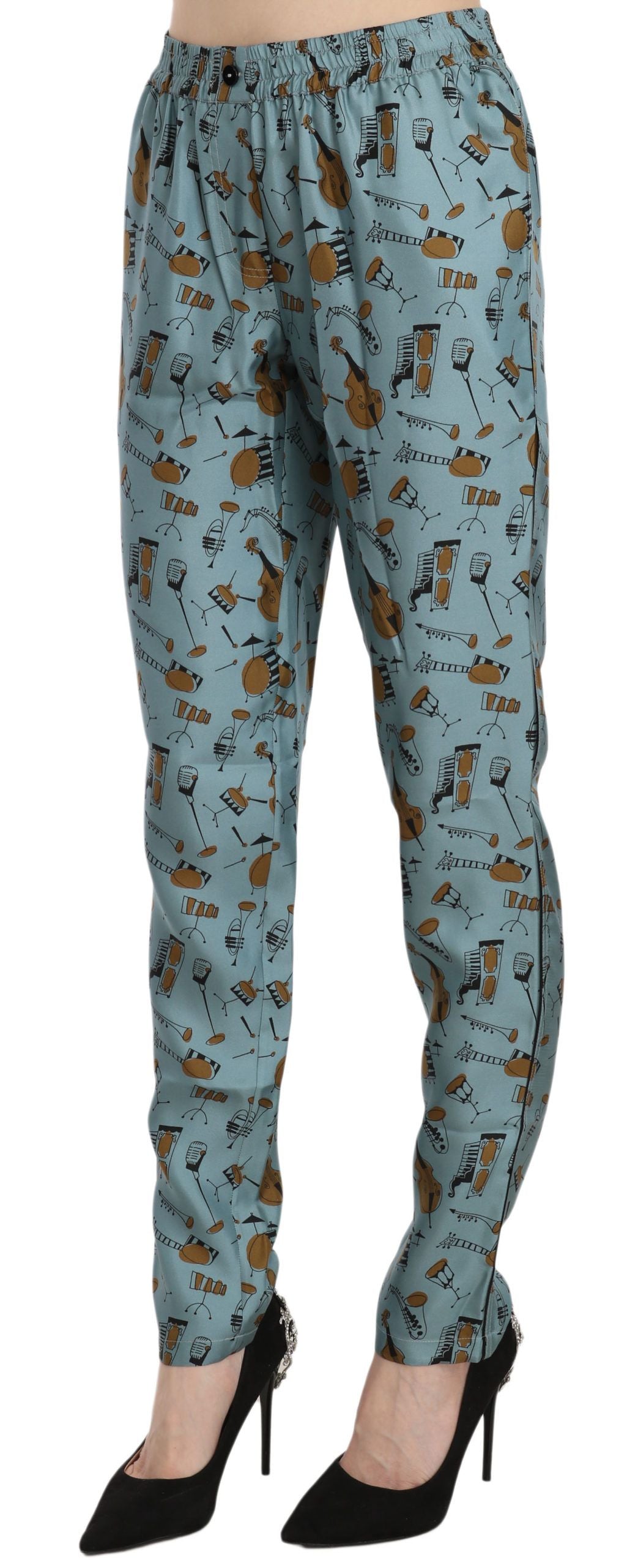 Blue musical instruments print tapered pants by Dolce & Gabbana featuring vibrant fabric and a modern slim fit design.