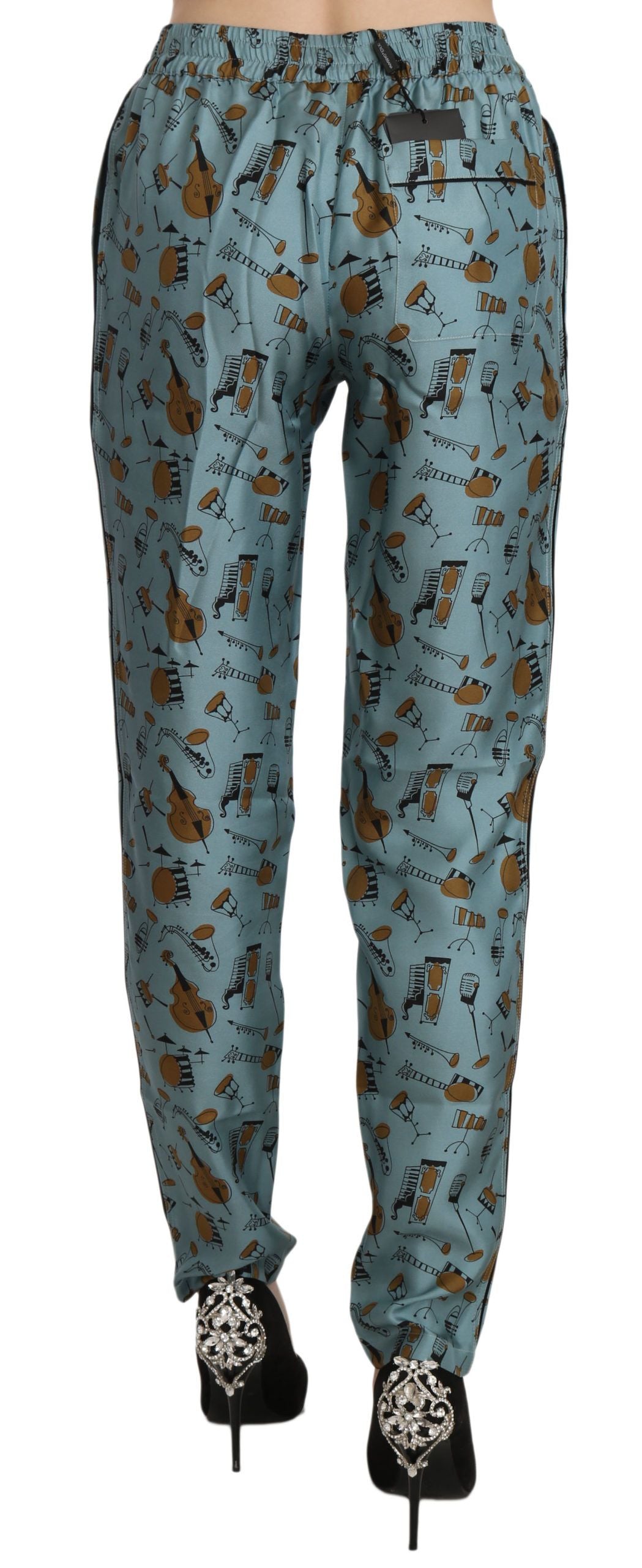Blue musical instruments print tapered pants by Dolce & Gabbana featuring a vibrant pattern and tailored fit.