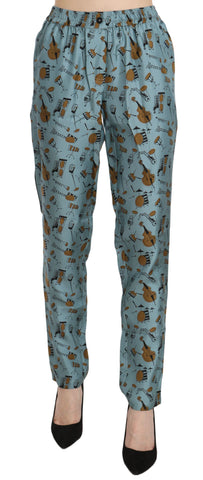 Blue musical instruments print tapered pants by Dolce & Gabbana featuring vibrant pattern and slim fit design.
