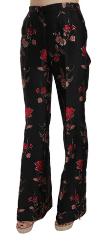 Black boot cut trouser pants with floral print by Dolce & Gabbana, showcasing tailored fit and stylish floral pattern.