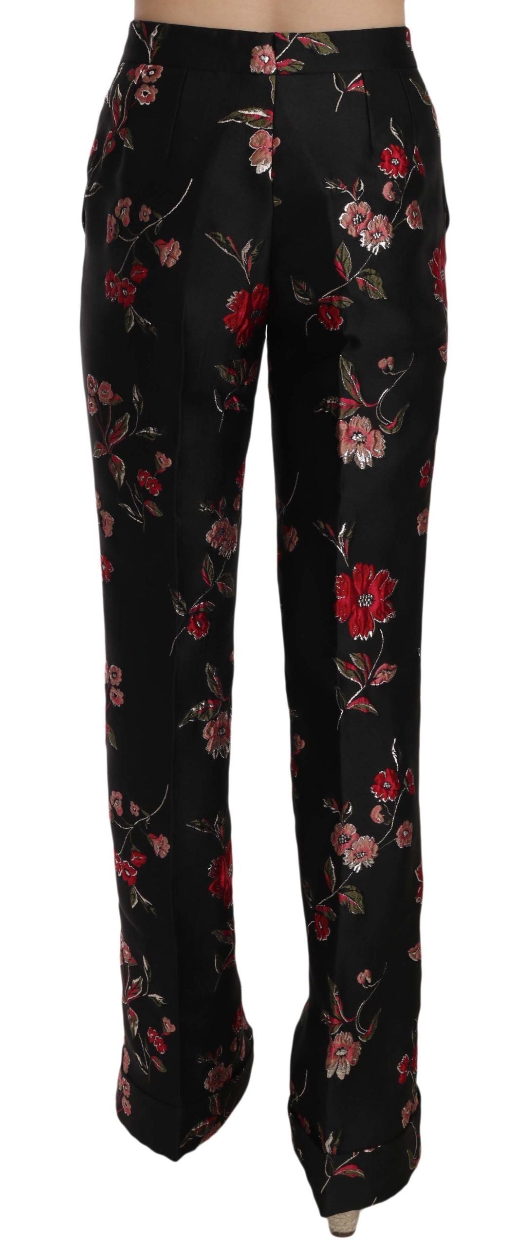 Black boot cut trousers with floral print by Dolce & Gabbana, showcasing a stylish, tailored fit and vibrant floral design.