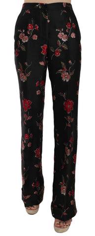 Black boot cut trouser pants with floral print by Dolce & Gabbana, shown in a stylish, tailored fit.