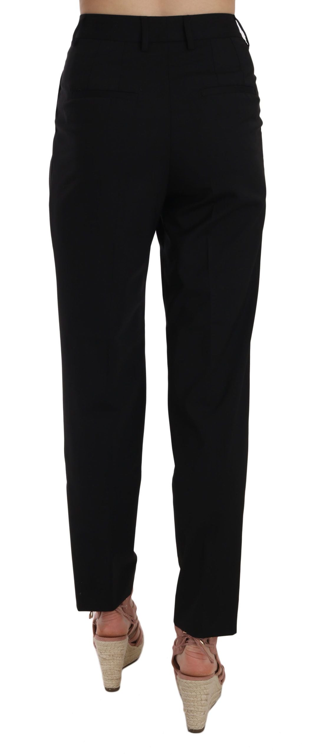 Black button-pleated tapered trousers by Dolce & Gabbana, showing the front view with pleats and tailored fit.