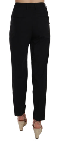 Black button-pleated tapered trousers by Dolce & Gabbana, showing the front view with pleats and tailored fit.