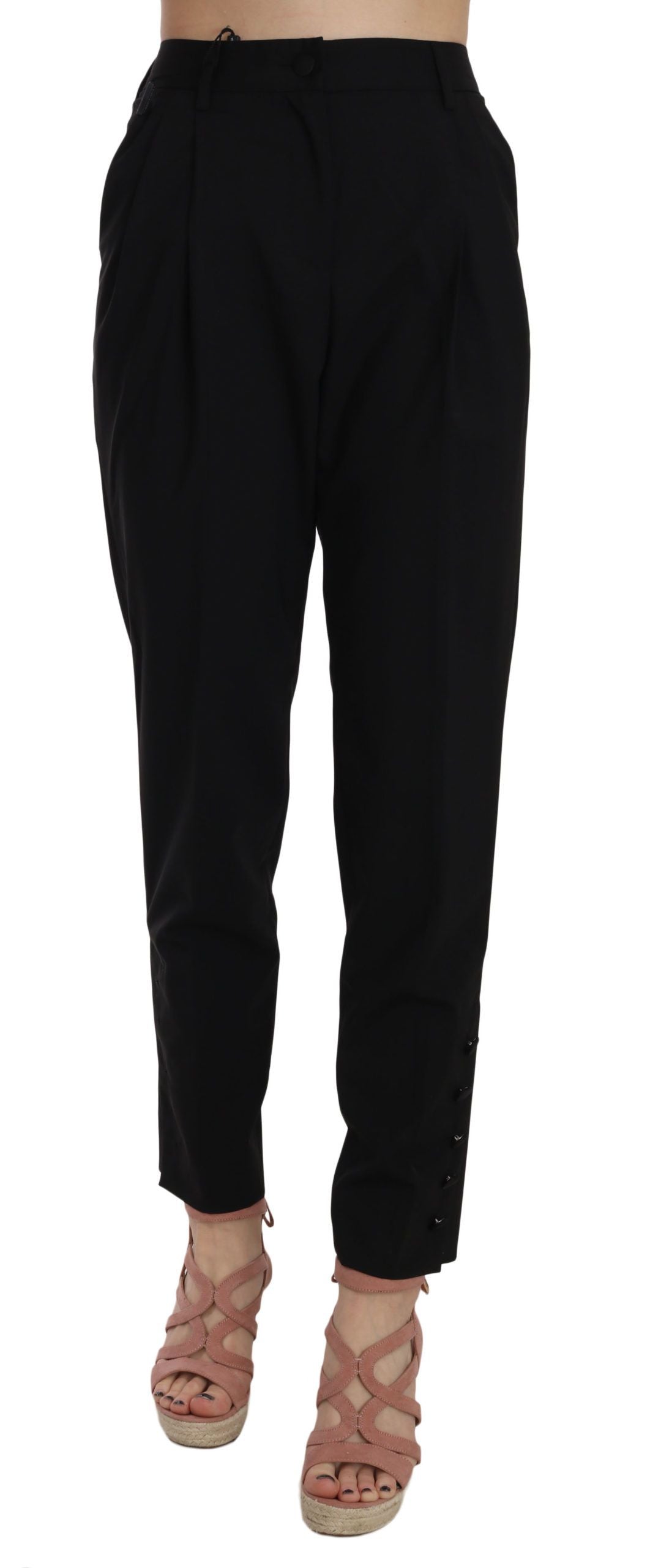 Black button-pleated tapered trouser pants by Dolce & Gabbana, featuring a tailored fit with pleats and sleek tapered legs.