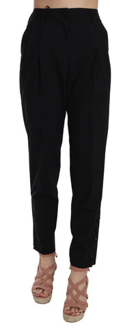 Black button-pleated tapered trouser pants by Dolce & Gabbana, featuring a tailored fit with pleats and sleek tapered legs.