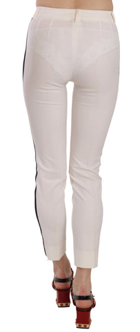 White side stripe cropped skinny pants by Dolce & Gabbana, featuring a slim fit with side stripe detail and cropped length.