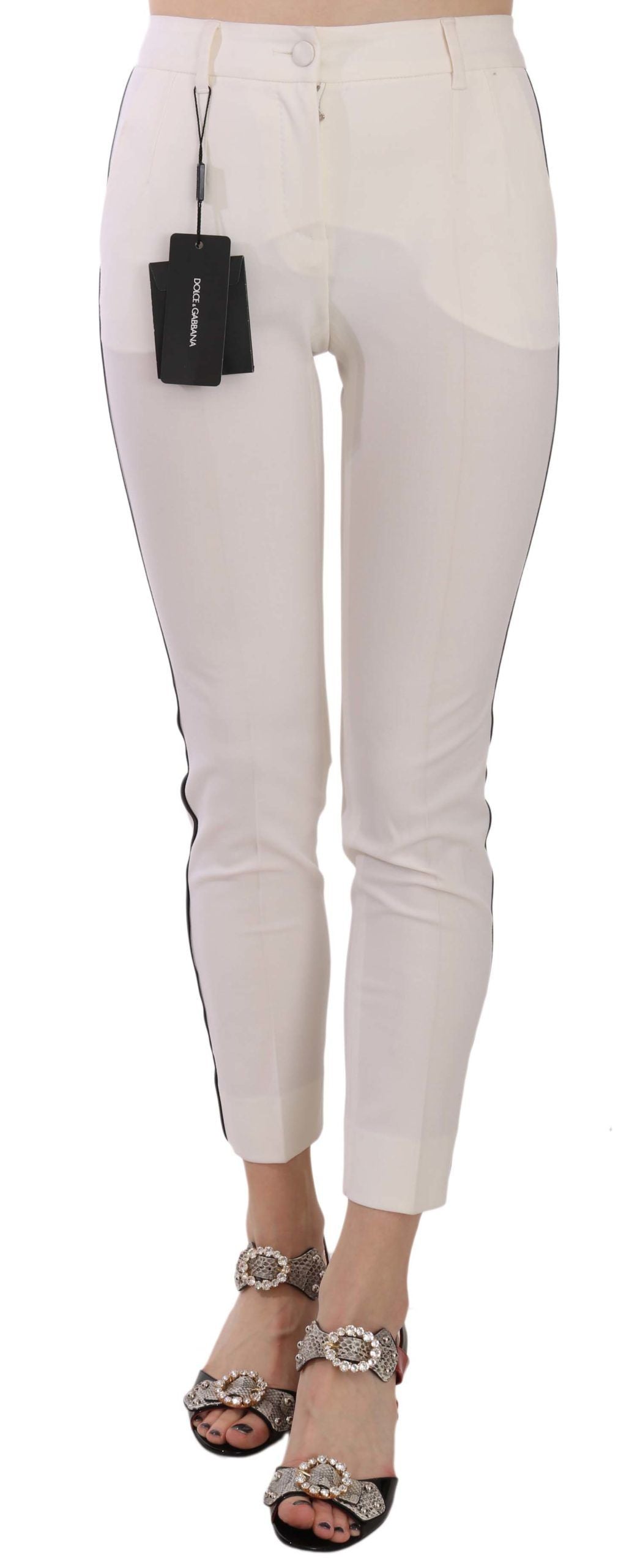White Dolce & Gabbana cropped skinny pants with side stripe detail, showcasing a slim fit and stylish design.