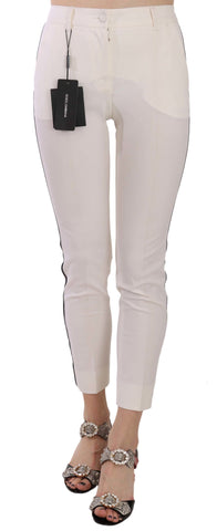 White Dolce & Gabbana cropped skinny pants with side stripe detail, showcasing a slim fit and stylish design.
