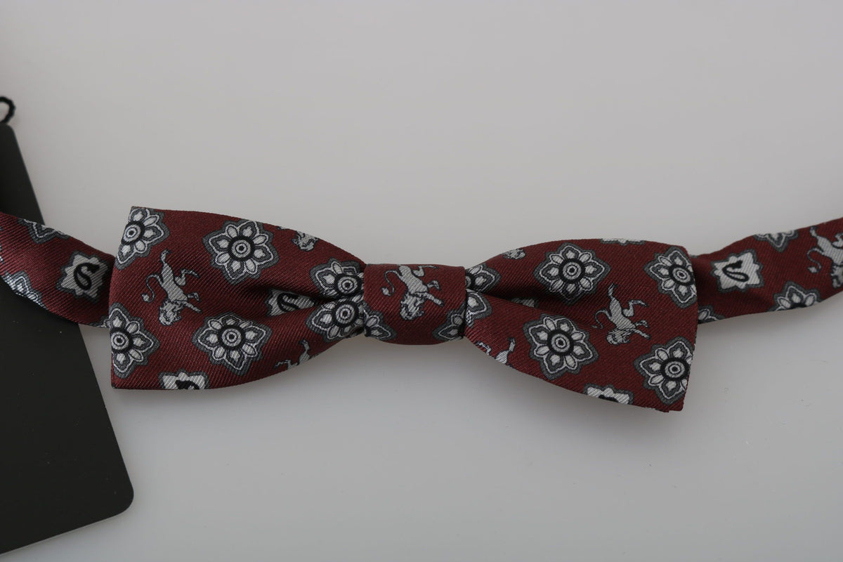 Men's Bordeaux maroon lion silk adjustable bow tie by Dolce & Gabbana, featuring a luxurious fabric and detailed lion pattern.
