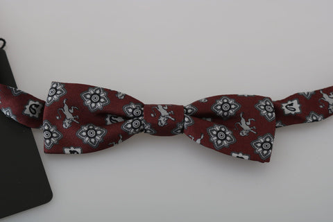 Men's Bordeaux maroon lion silk adjustable bow tie by Dolce & Gabbana, featuring a luxurious fabric and detailed lion pattern.