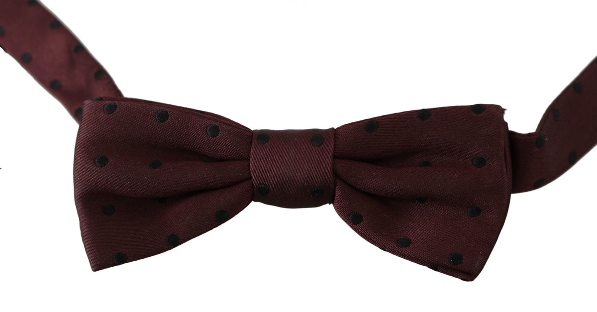 Purple dotted silk adjustable neck papillon bow tie by Dolce & Gabbana, featuring a stylish and elegant design.