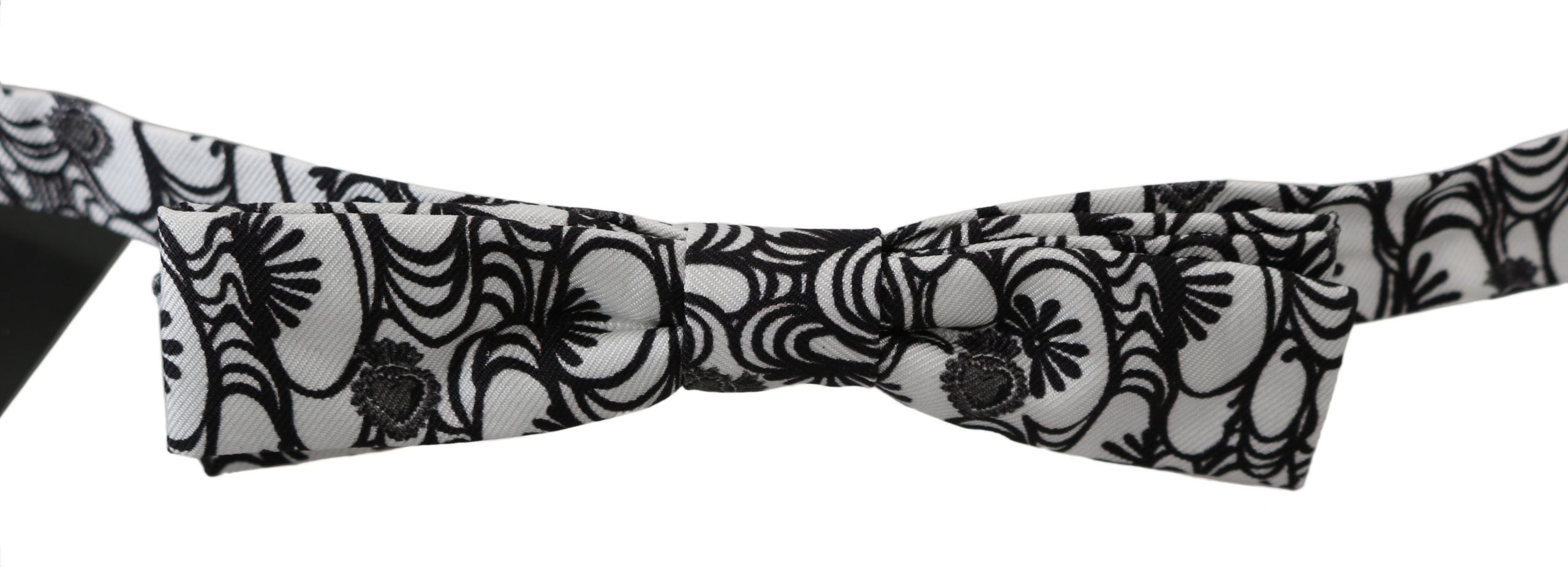 White patterned silk adjustable neck papillon tie by Dolce & Gabbana, featuring a stylish bow design and elegant fabric.