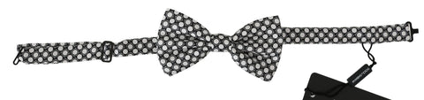 Men's black and white circle pattern adjustable neck papillon bow tie by Dolce & Gabbana, featuring classic design and fabric texture.