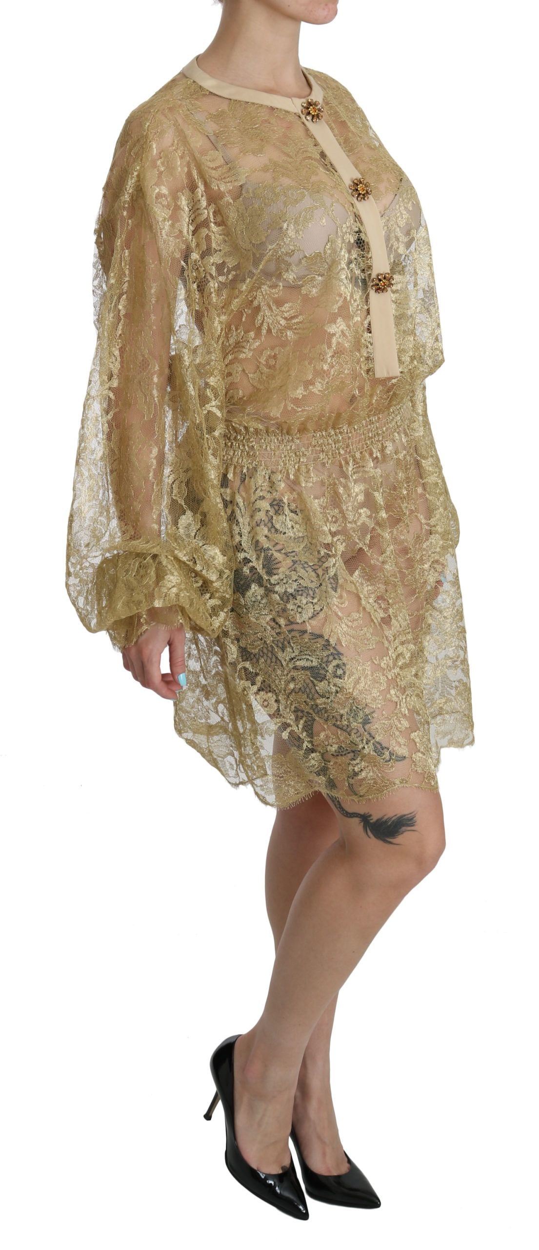 Gold lace see-through A-line knee-length dress by Dolce & Gabbana, featuring intricate lace details and a flowing silhouette.