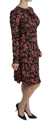 Black floral longsleeve knee-length dress by Dolce & Gabbana, featuring a fitted silhouette and elegant floral pattern.
