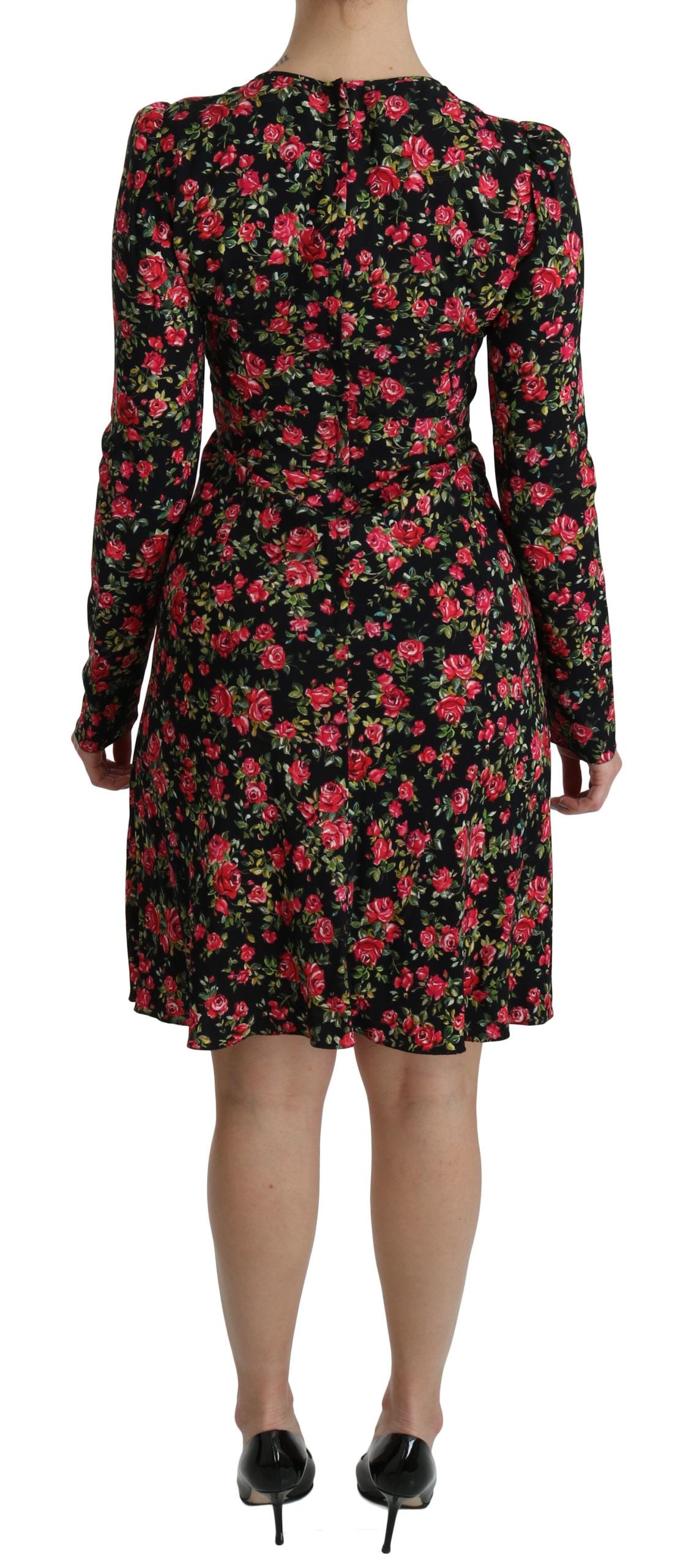 Black floral longsleeve knee-length dress by Dolce & Gabbana, featuring elegant floral pattern and fitted silhouette.
