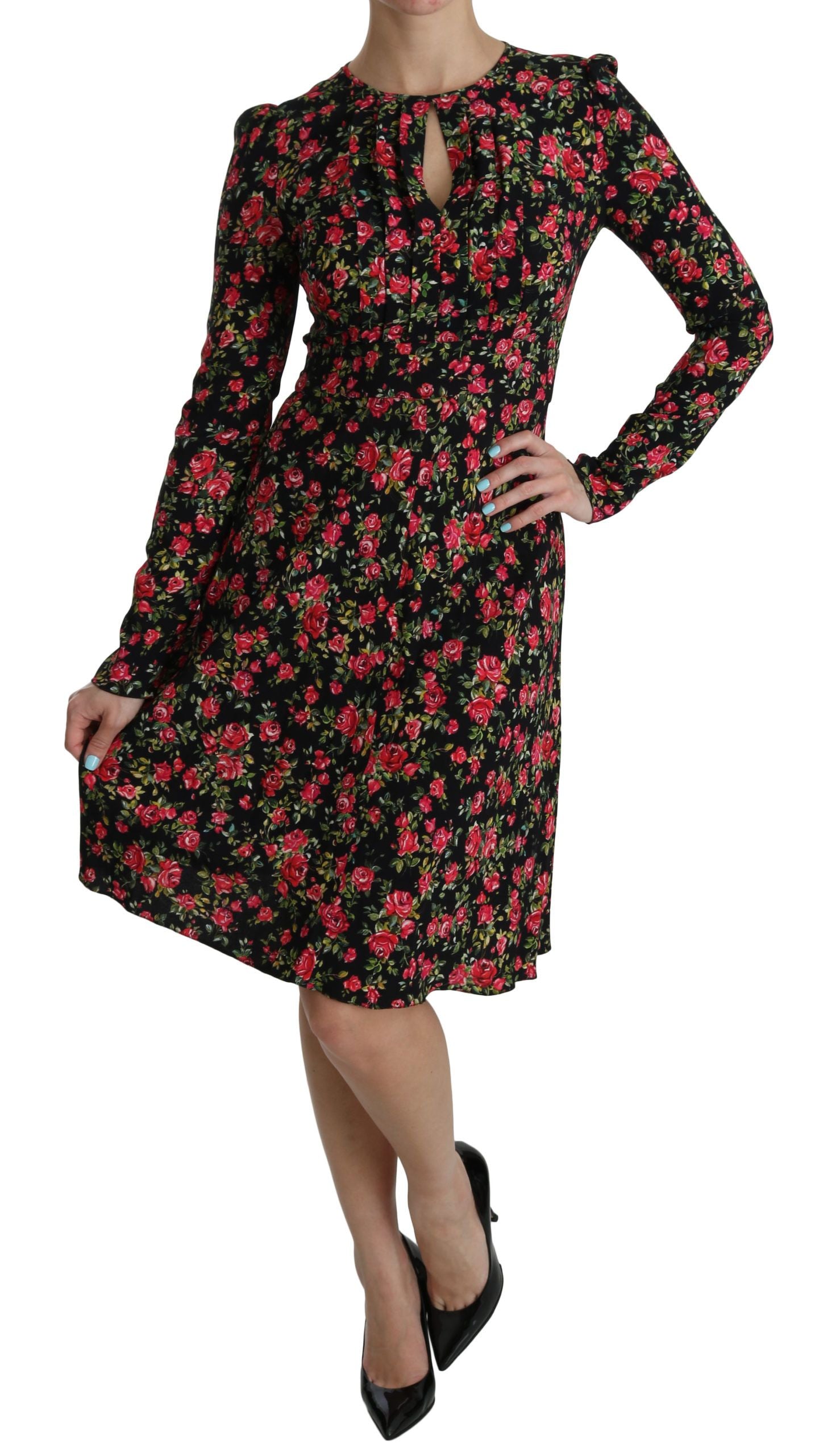 Black floral long-sleeve knee-length dress by Dolce & Gabbana, featuring a fitted silhouette and elegant design.