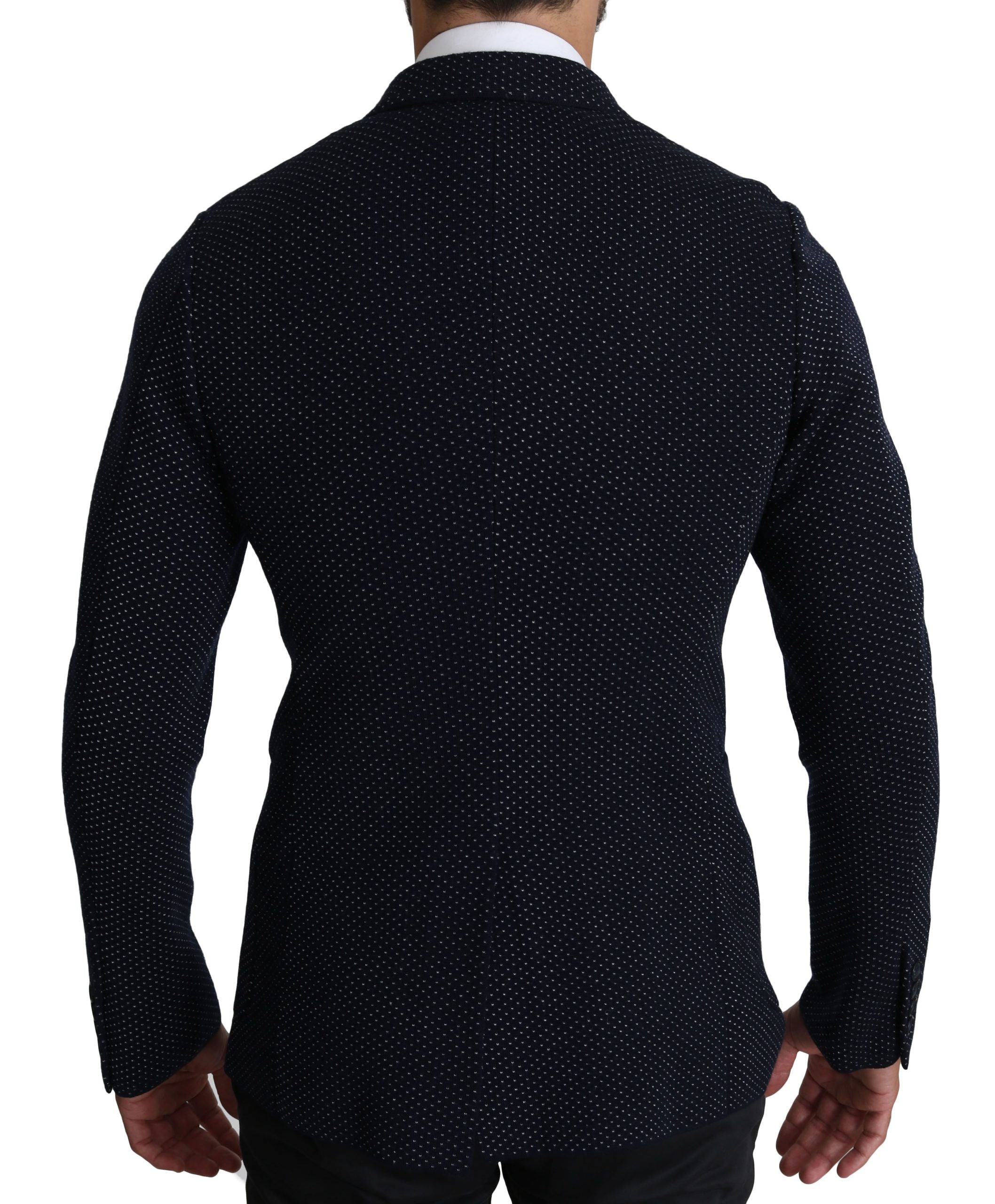 Dark blue dotted double-breasted coat blazer by Dolce & Gabbana with tailored fit and classic lapels, displayed on a hanger.